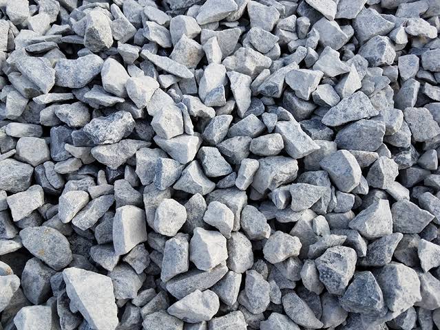 Pile of grey crushed ballast aggregate for construction